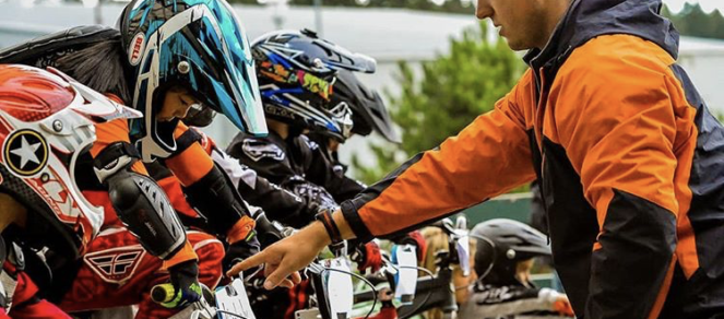 Man coaching bikers