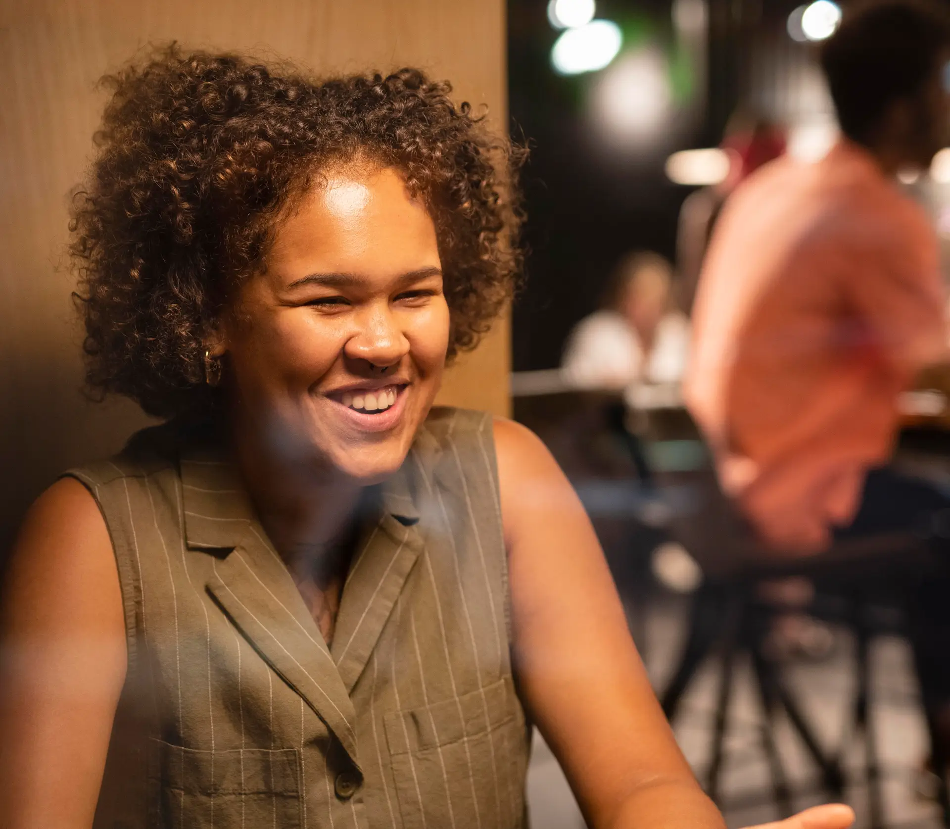 woman smiling during small business financial advisor coaching session