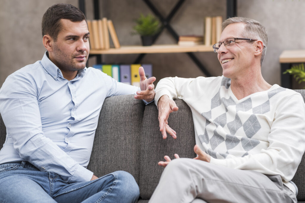 Close-up of a coach listening attentively, reflecting back client words and noticing nonverbal cues during a session.
