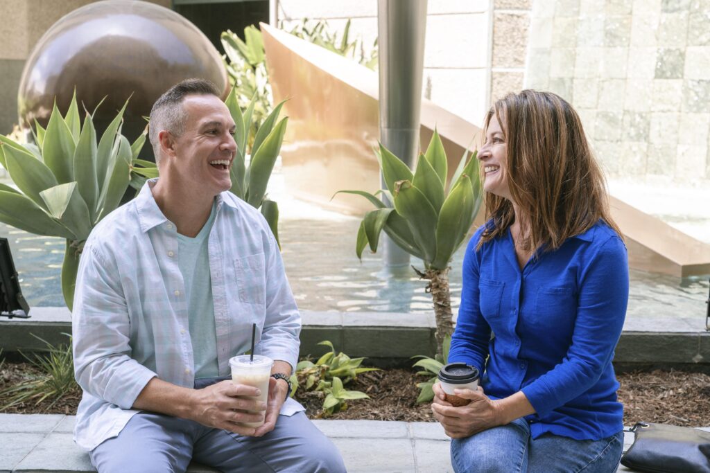 Coach staying fully present and focused, showing confidence and calm in a coaching conversation with a client.