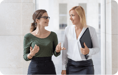 Two professionals discussing small business coaching during Small Business Coaching Foundations training