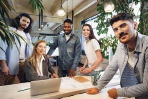 Small business team working together as the business grows and creates local jobs.