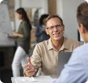 Business coach participating in ICF-aligned coaching skills training