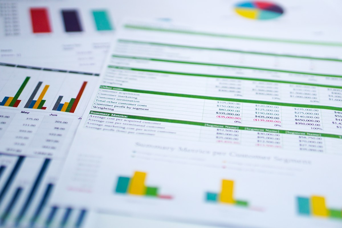 Financial reports with charts and tables, representing coaching skills for accountants working with small business owners