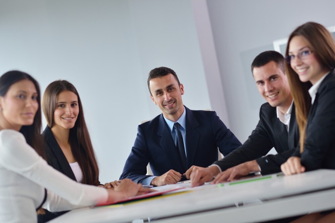 Business professionals discussing priorities together in a team meeting